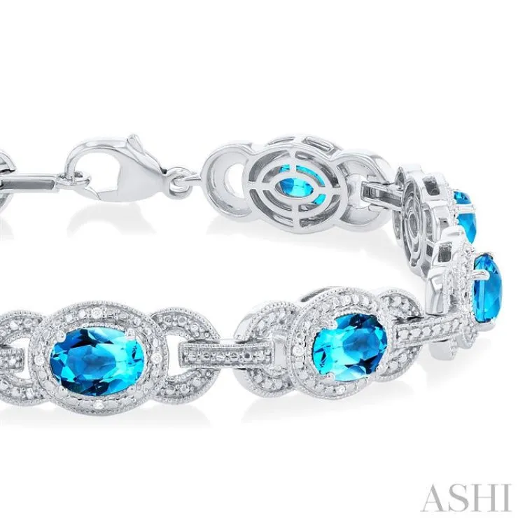 7x5 MM Oval Shape Blue Topaz and 1/10 ctw Round Cut Diamond Semi Precious Bracelet in Sterling Silver