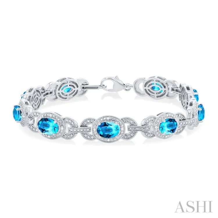 7x5 MM Oval Shape Blue Topaz and 1/10 ctw Round Cut Diamond Semi Precious Bracelet in Sterling Silver