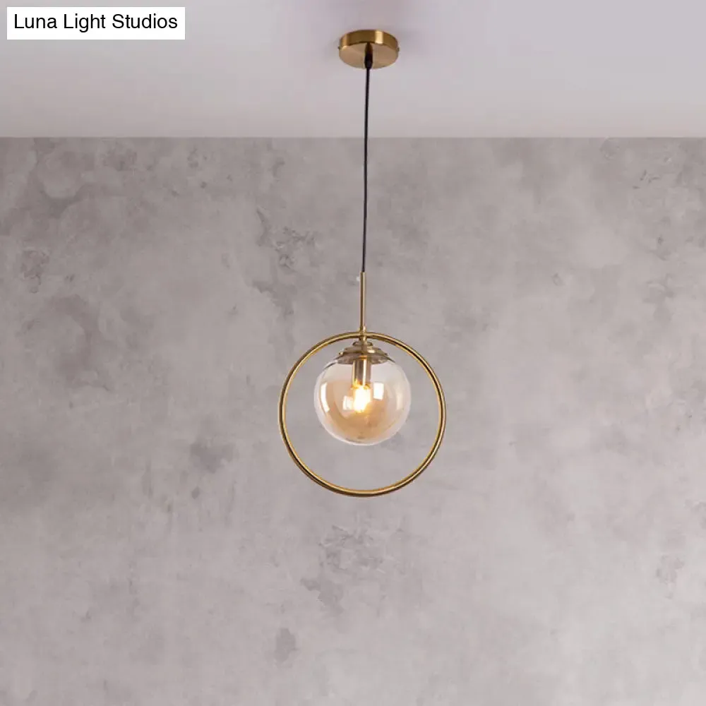 Postmodern Glass Pendant Light with Brass Ring for Bedroom - Single-Bulb Globe Down Lighting in Clear, Amber, and Smoke Grey